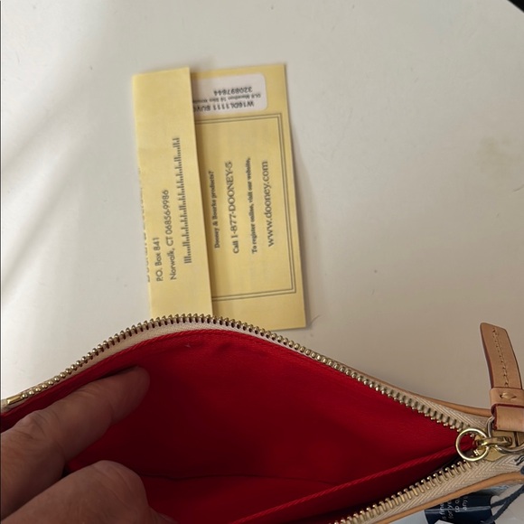 Dooney & Bourke Blue and Tan Wristlet with Theme Park Icons - Picture 3 of 3